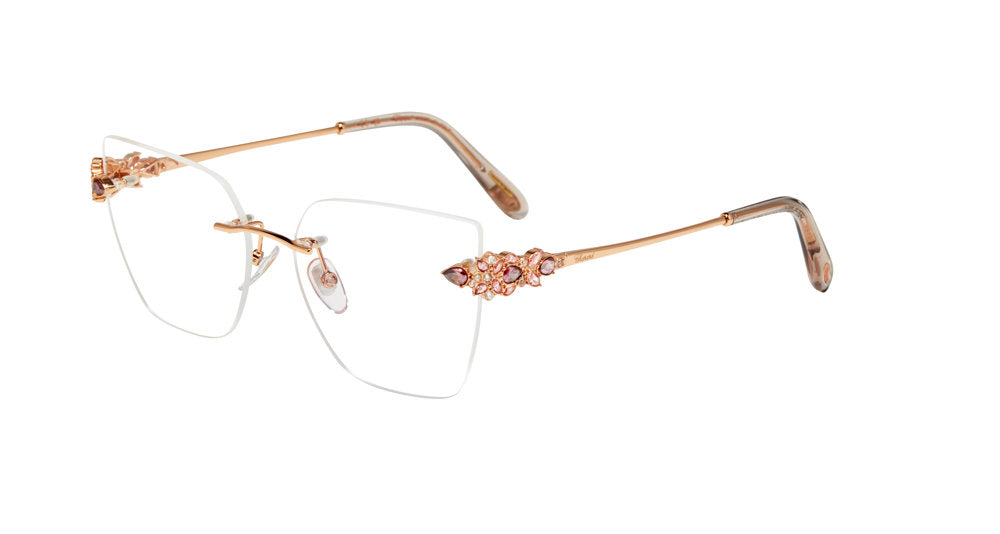 Chopard VCHM47S women's various-form rimless eyeglasses in Copper Gold with ornate temple accents and translucent temple tips.

