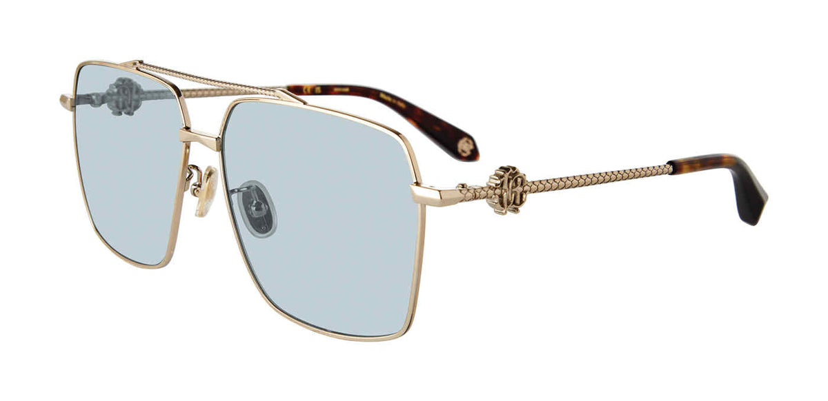 Roberto Cavalli SRC036V unisex navigator sunglasses in Shiny Grey Gold with full rims, light blue-gray lenses, textured temples, side monograms, and brown-patterned tips.

